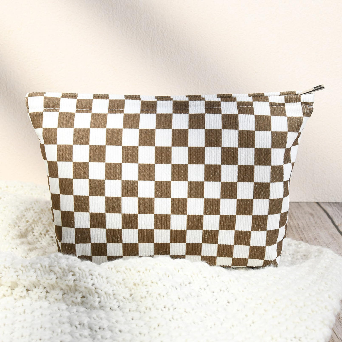 SOIDRAM checkered makeup bag packed in a suitcase