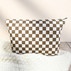 SOIDRAM checkered makeup bag packed in a suitcase
