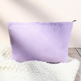 SOIDRAM cosmetic bags stacked together in purple