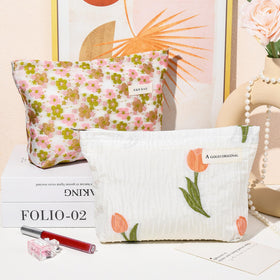 SOIDRAM floral makeup bag opened with makeup items visible