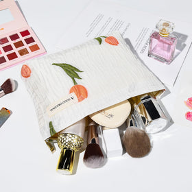 SOIDRAM floral makeup bag packed in a suitcase