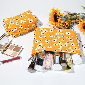 SOIDRAM Flower Makeup Bag in a travel setup with suitcase