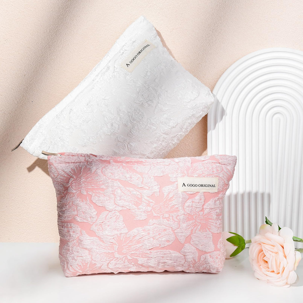 SOIDRAM Flower Makeup Bag Set on a travel suitcase