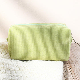 SOIDRAM light green makeup bags lifestyle shot on a vanity