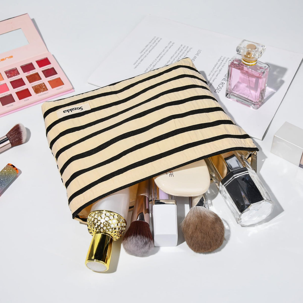 SOIDRAM makeup bag displayed on a vanity with beauty products