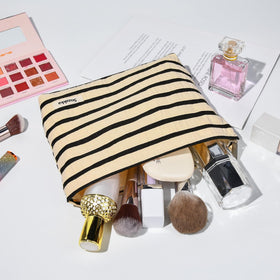 SOIDRAM makeup bag displayed on a vanity with beauty products