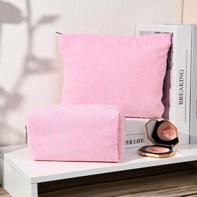 SOIDRAM makeup bags stacked on a vanity