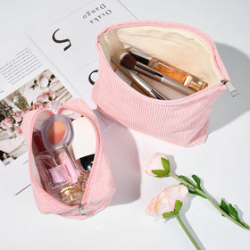 SOIDRAM small makeup bag on a travel suitcase