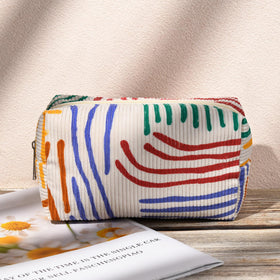 SOIDRAM Stripes Makeup Bag Set on a vanity with beauty products