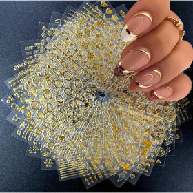 SPLOCUDU 30 sheets gold nail art stickers featuring various designs