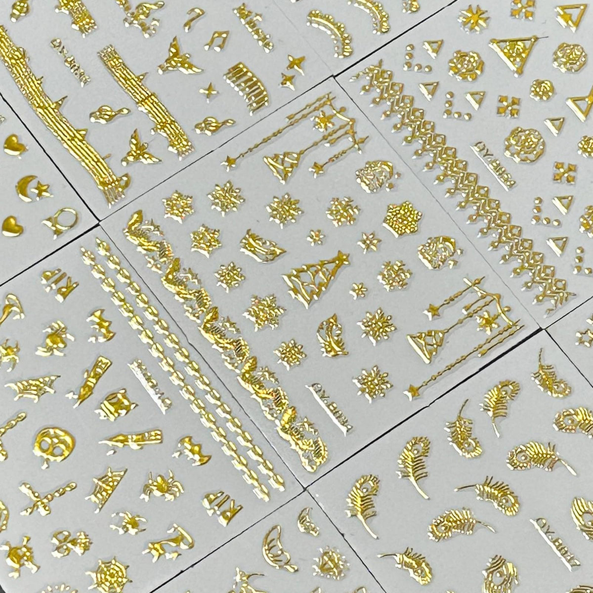 SPLOCUDU gold nail stickers in various patterns including flowers and stars