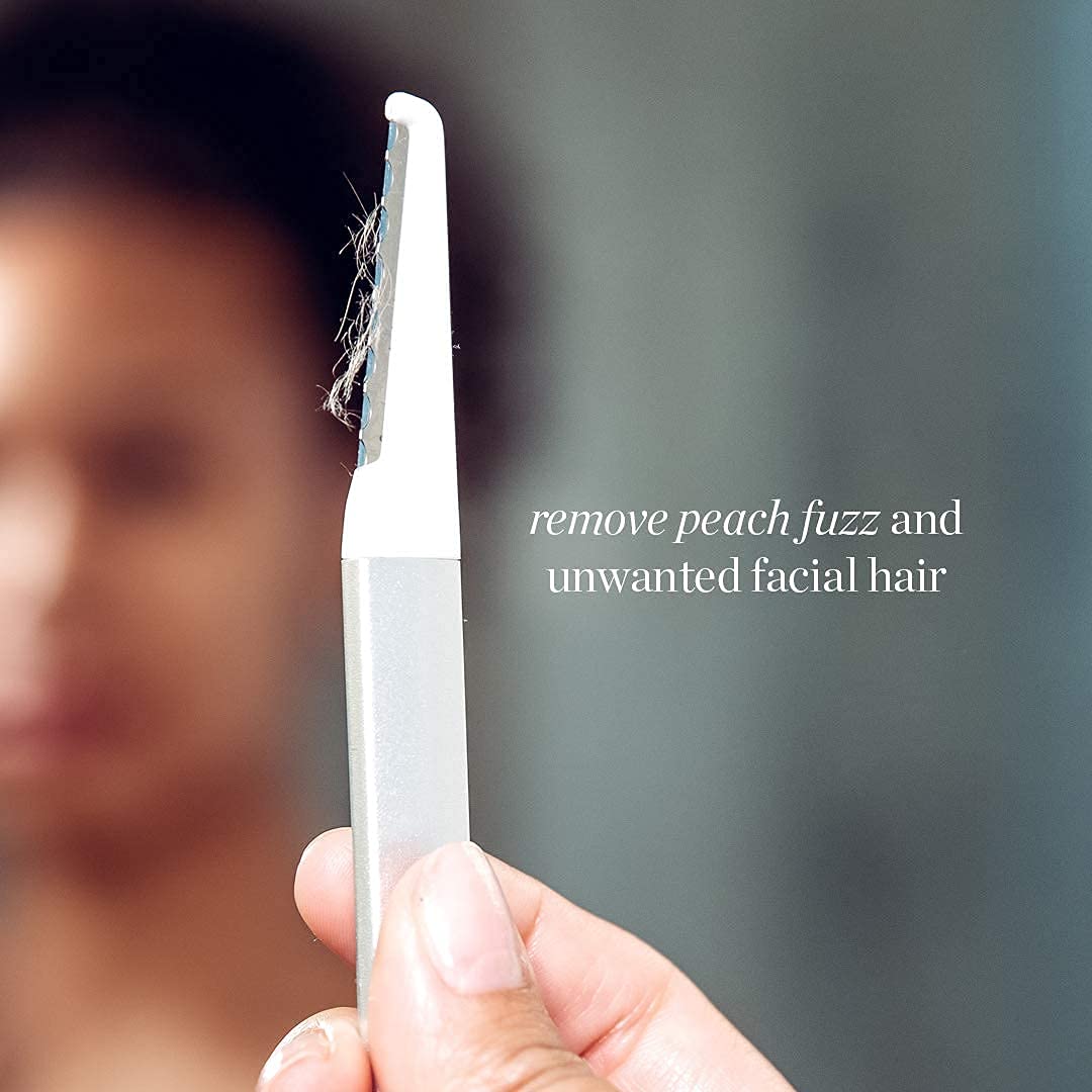 StackedSkincare Dermaplaning tool next to replacement blades