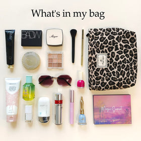 STARDW Leopard Makeup Bag Organizer lifestyle scene with travel items