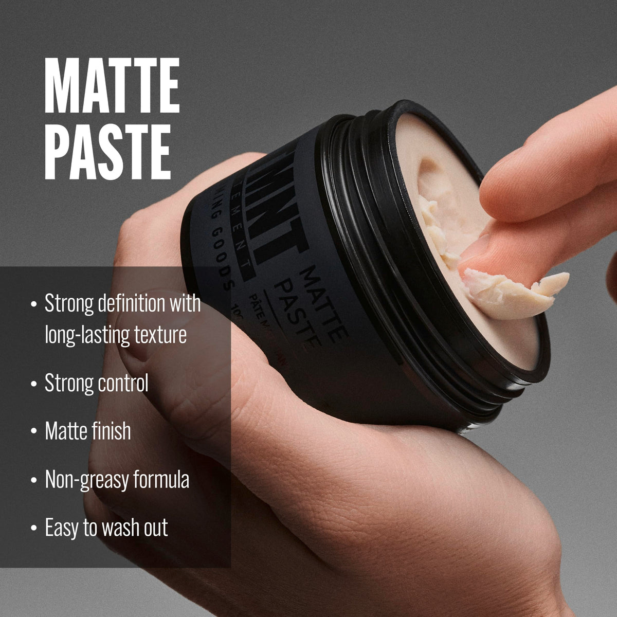 STMNT Matte Paste 3.38 oz showing texture on fingers