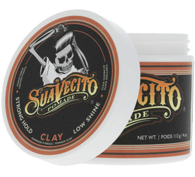 Suavecito Pomade Firme Clay 4 oz on a bathroom shelf
