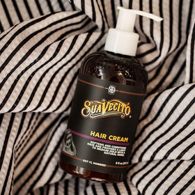 Suavecito Pomade Hair Cream on a styling table