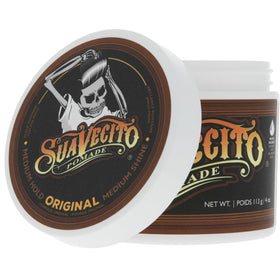 Suavecito Pomade Original All Day Hold 4 Oz next to grooming tools