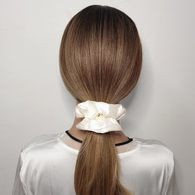 Sufermoe satin silk hair scrunchies displayed in a variety of light colours