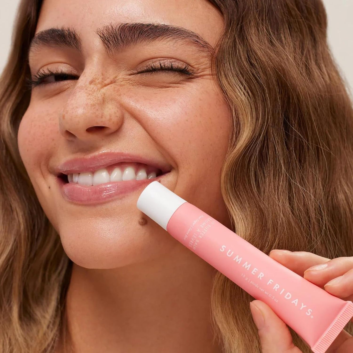 Summer Fridays Lip Butter Balm showing texture on a fingertip