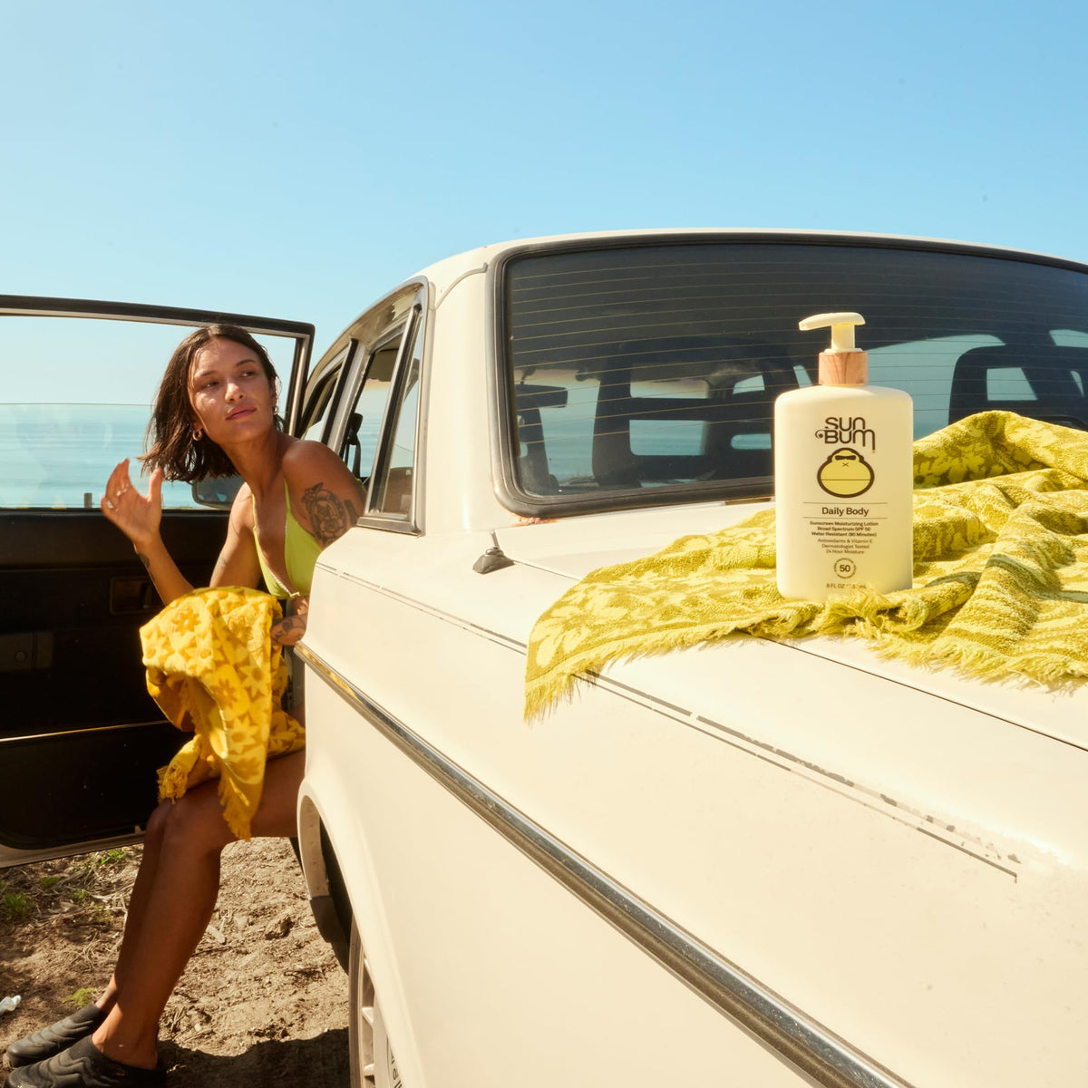 Sun Bum Daily SPF 50 Sunscreen Body Lotion side view showing pump