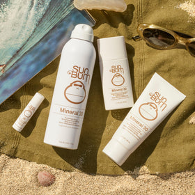 Sun Bum Mineral SPF 30 Sunscreen Body Lotion 3 oz with beach background