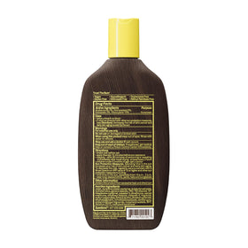 Sun Bum Original SPF 15 Sunscreen Body Lotion packaging on a towel