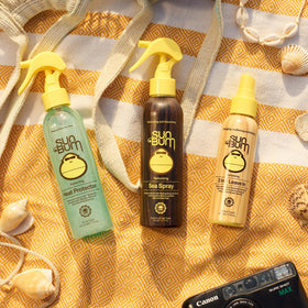 Sun Bum Sea Spray 6 oz with beach background