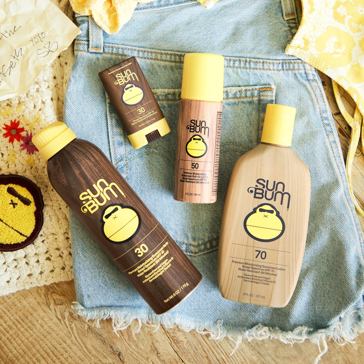 Sun Bum SPF 50 Roll-On Sunscreen 3 oz with beach background