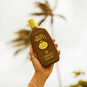 Sun Bum sunscreen lotion application on skin