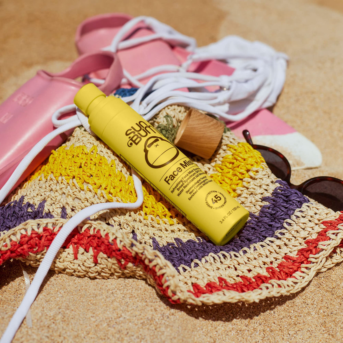 Sun Bum sunscreen mist application on face