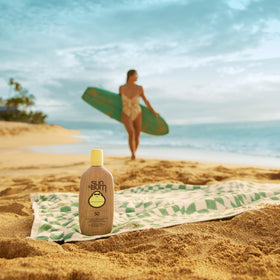 Sun Bum sunscreen with beach accessories