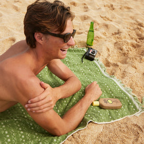 Sun Bum sunscreen with Vitamin E highlighting moisturizing benefits