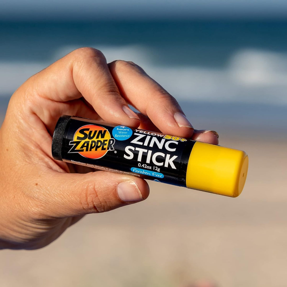 Sun Zapper Zinc Oxide Sunscreen Stick SPF 50+ yellow on outdoor scene