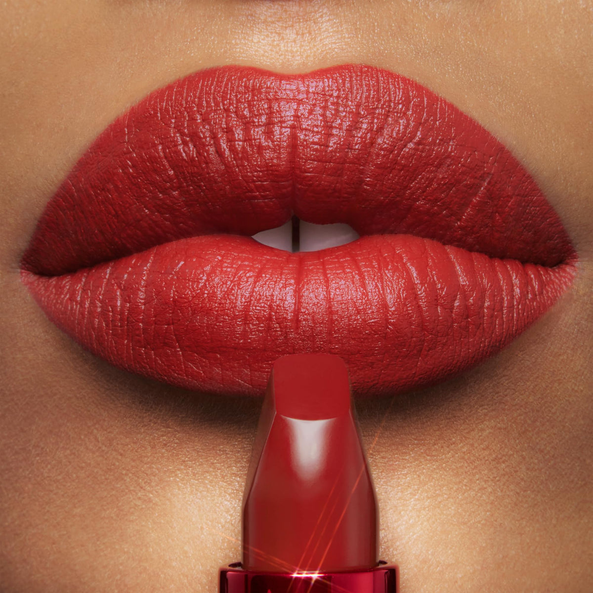 Swatch of Charlotte Tilbury Matte Revolution Lipstick on skin