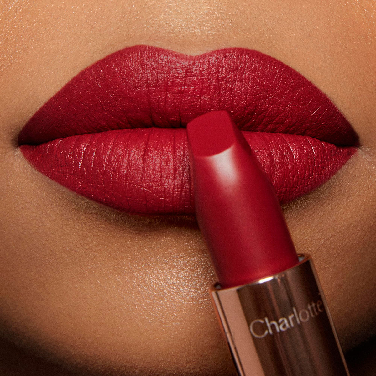 Swatch of Charlotte Tilbury Matte Revolution Lipstick Red Carpet Red