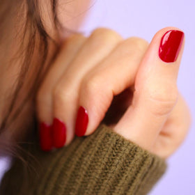Swatch of Manucurist Green Red Cherry Nail Polish on nails