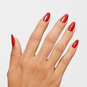 Swatch of OPI Infinite Shine Big Apple Red on nails