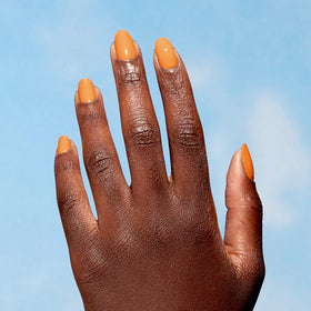Swatch of OPI Nature Strong bright yellow nail polish on nails