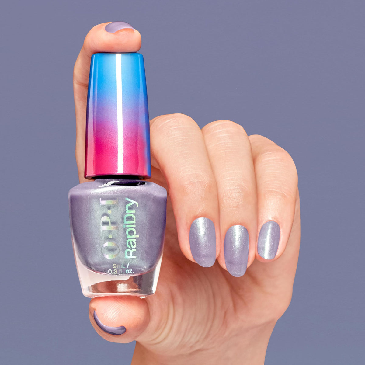 Swatch of OPI RapiDry soft gray pearl nail polish on a nail