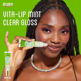 Swatch of Ruby Kisses Vita-Lip Gloss on a skin tone