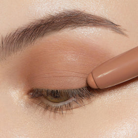 Swatches of ColourPop Nude Attitude Shadow Stix on skin showing metallic and matte finishes
