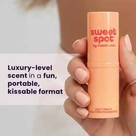 Sweetums SweetSpot Peach Perfume Stick application on skin