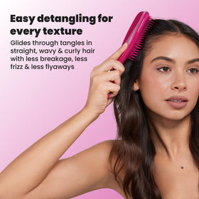 TANGLE TEEZER brush in hand demonstrating ease of use