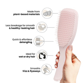 TANGLE TEEZER detangler brush on a bathroom counter