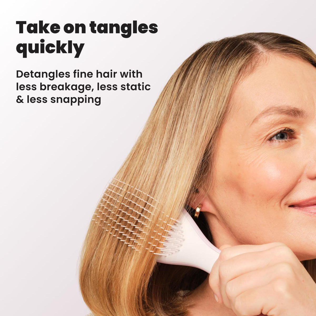 TANGLE TEEZER Fine Ultimate Detangler Brush displayed with hair products