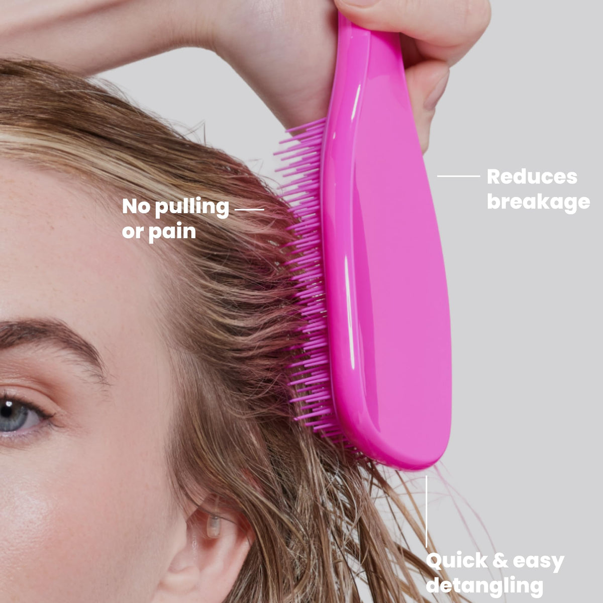 TANGLE TEEZER Fine Ultimate Detangler Brush in hand demonstrating use