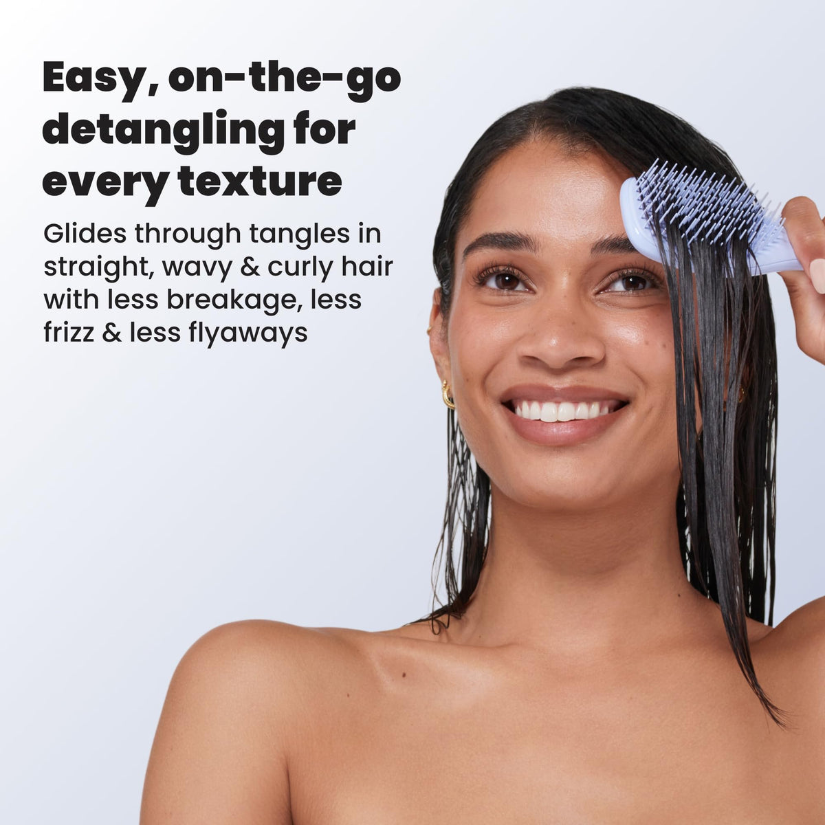 TANGLE TEEZER Mini Hair Brush Digital Lavender held in hand
