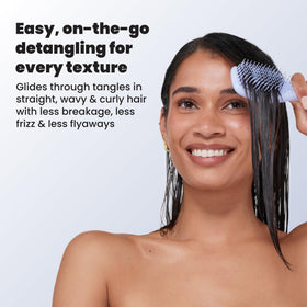 TANGLE TEEZER Mini Hair Brush Digital Lavender held in hand