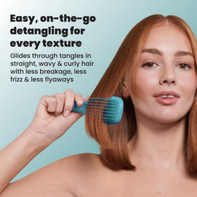 TANGLE TEEZER Mini Hair Brush held by a child