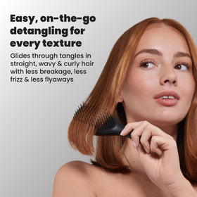 TANGLE TEEZER Mini Hair Brush in a child's hand